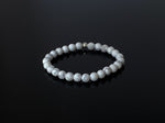 This bracelet is made with 5-6mm natural Howlite gemstone beads and a sterling silver accent bead.