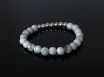 This bracelet is made with 8mm natural Howlite gemstone beads and 7 sterling silver accent beads.