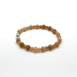 This bracelet is made with 4-6mm multi-colour Moonstone gemstone beads and 3 sterling silver accent beads.